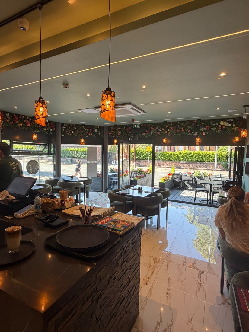 Cafe interior with hanging lanterns and marble floors
